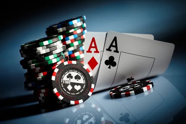 Live dealer at Andar Bahar table with cards and chips